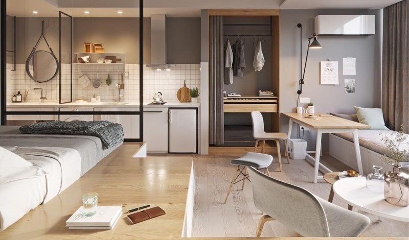 Sun Xuân Thủy Cầu Giấy 7 Không gian nội thất căn hộ studio hiện đại tại dự án Sun Xuân Thủy, bố trí mở gồm bếp, giường ngủ, bàn làm việc và tủ quần áo, tông màu xám – gỗ sáng mang lại cảm giác ấm cúng và tiện nghi.